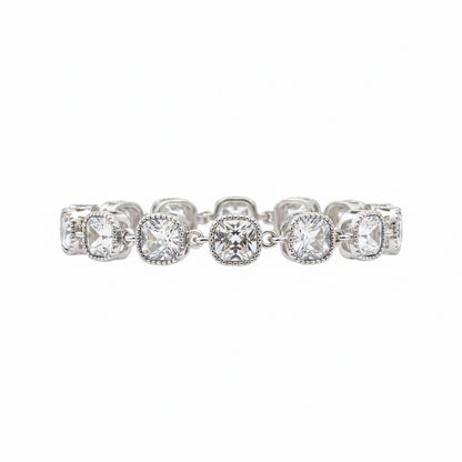 The Jason Silver Clear Crystal Tennis Bracelet features cushion-cut clear crystals in detailed linked bezels. Available in sizes 6.5", 7", and 7.5".