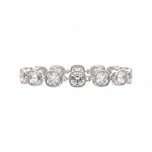 The Jason Silver Clear Crystal Tennis Bracelet features cushion-cut clear crystals in detailed linked bezels. Available in sizes 6.5", 7", and 7.5".