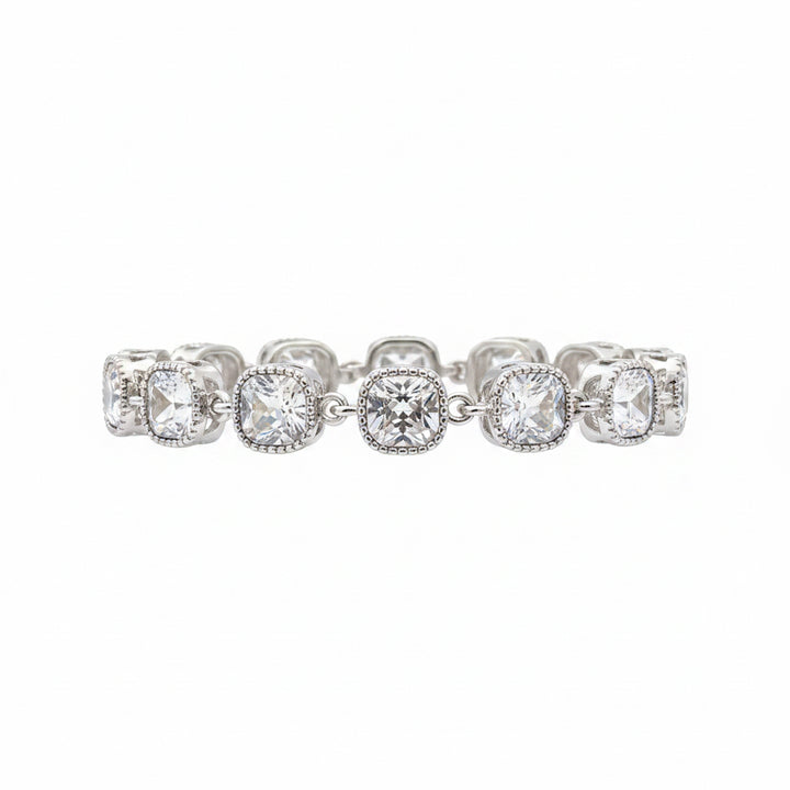The Jason Silver Clear Crystal Tennis Bracelet features cushion-cut clear crystals in detailed linked bezels. Available in sizes 6.5", 7", and 7.5".