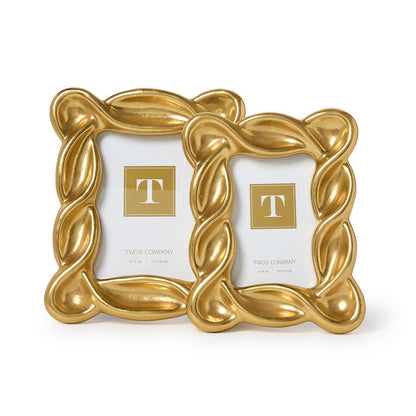 Two Infinity Gold Leaf Frames with wavy, ribbon-like edges. Available sizes: 5x7 and 8x10 inches.