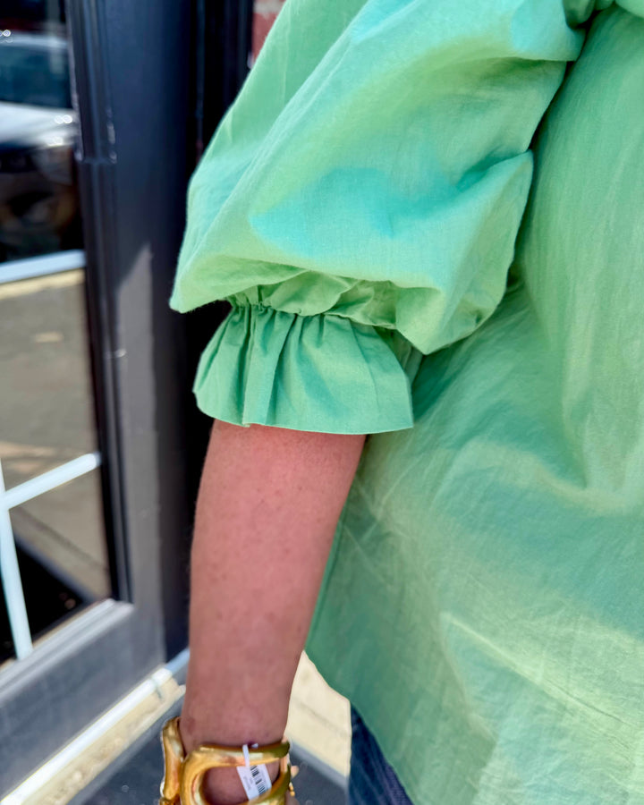 Mint Button Down Blouse with front buttons and long sleeves; available in sizes XS-XL.