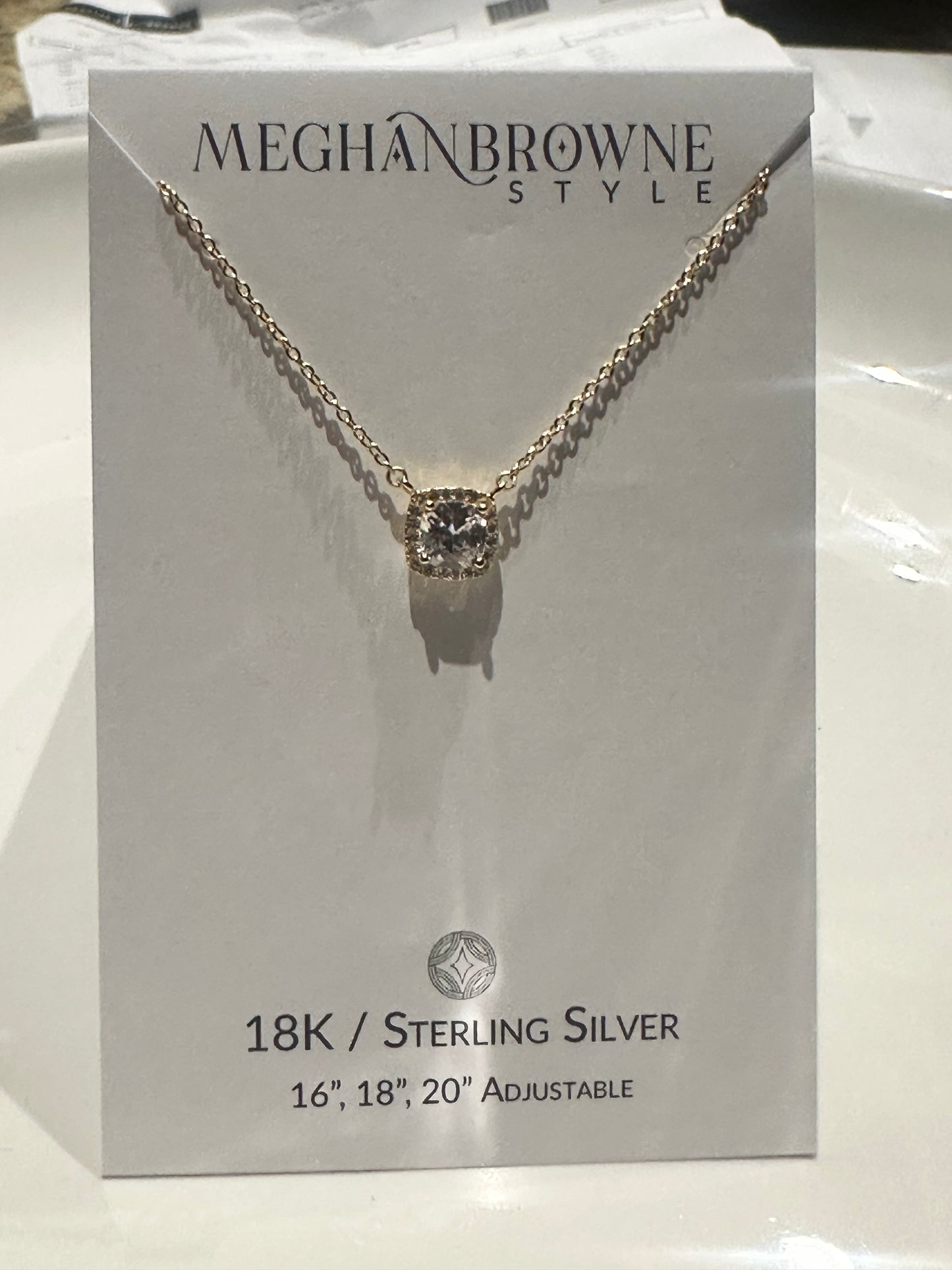 Gold chain necklace with round cubic zirconia pendant; adjustable to 16", 18", or 20".