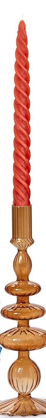 Tall, twisted red candle in ornate amber handblown glass holder with circular and ribbed designs. Available in various sizes.