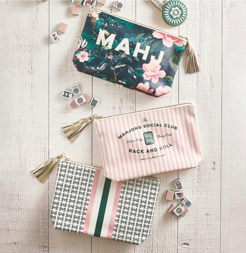 Set of three Mahjong Oil Cloth Pouches with tassels in floral, striped, and geometric patterns. Available in small, medium, and large sizes.