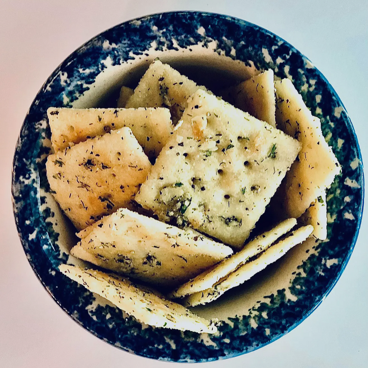 Square crackers coated with Garlic Parmesan Cracker Seasoning Mix. Available in 4oz and 8oz sizes.