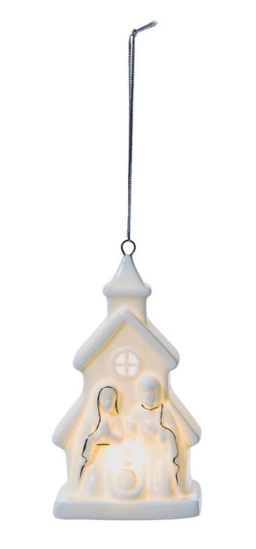 Starry Manger Light-Up Keepsake Ornament, shaped like a small church with a nativity scene silhouette inside.