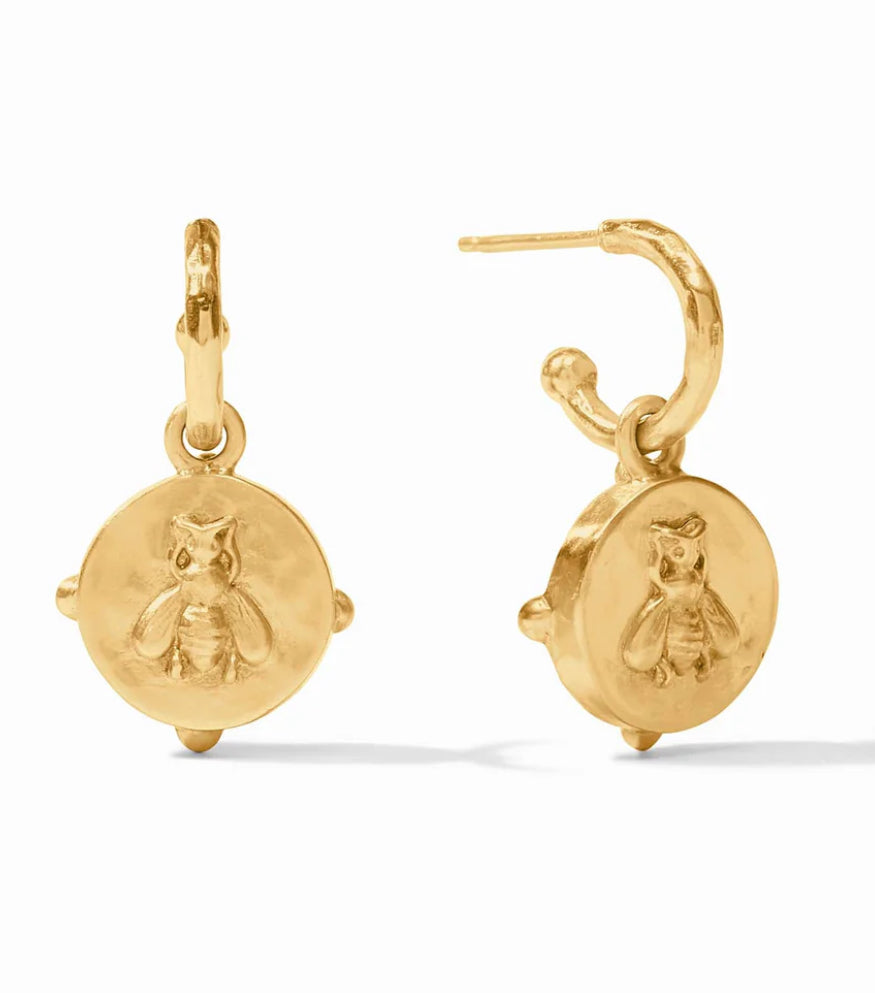 The Honeybee Hoop & Charm Earring Mother Of Pearl: 24K gold hoop earrings with circular pendants featuring an embossed bee design. Latch-back closure. Available sizes: Small, Medium, Large.