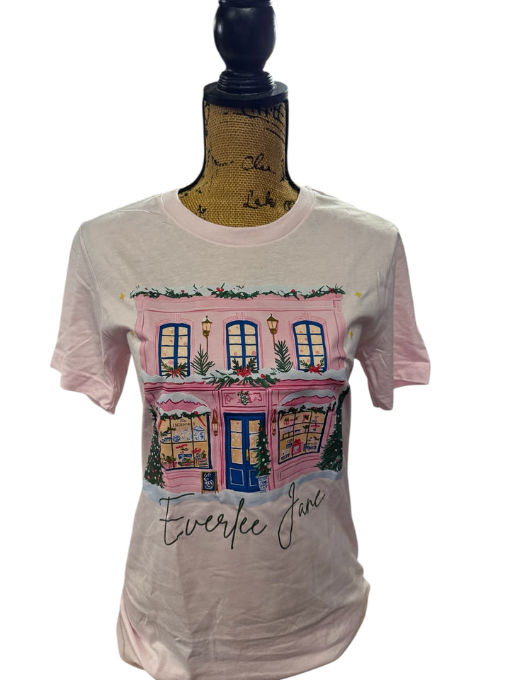 The Pink Store Everlee Jane T-shirt features a festive storefront and "Everlee Jane" below. Available in sizes S–XL.