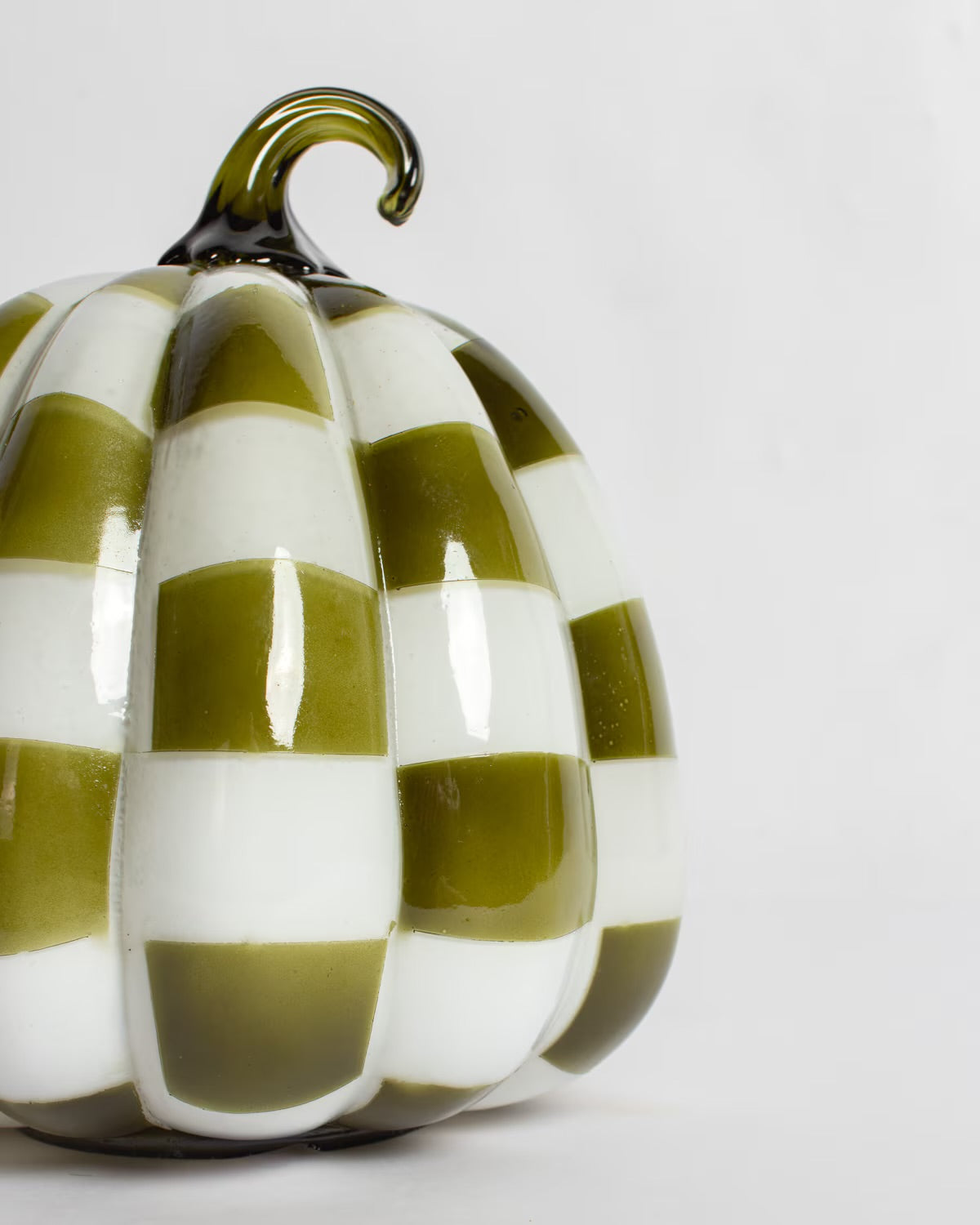 Glossy green and white checkered glass pumpkin with a curled stem; available in multiple sizes.