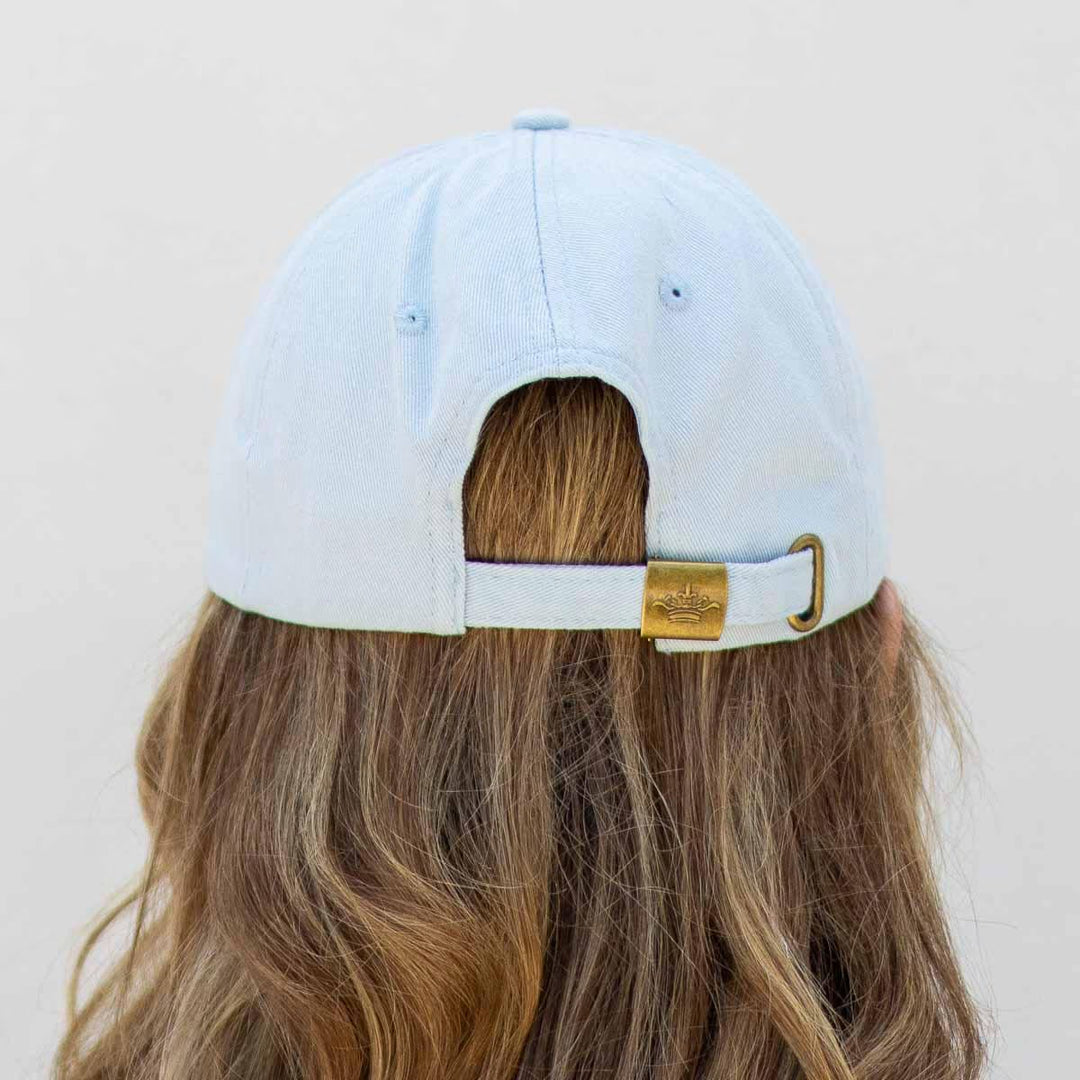Texas Baseball Hat in light blue with adjustable strap and gold buckle. Available in S, M, L.