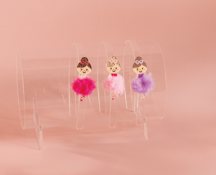 Set of three ballerina hair clips with smiling faces and tutu skirts in pink, hot pink, and purple. Available in small and medium sizes.
