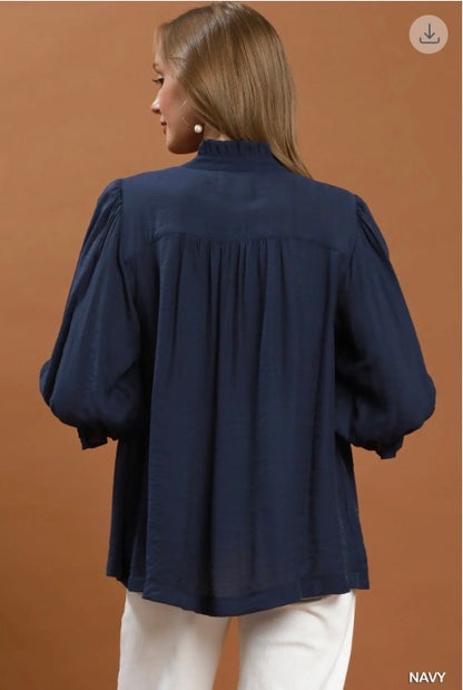 Navy Smocked Yoke Button Front Blouse with puffed long sleeves; available in sizes XS–XL.