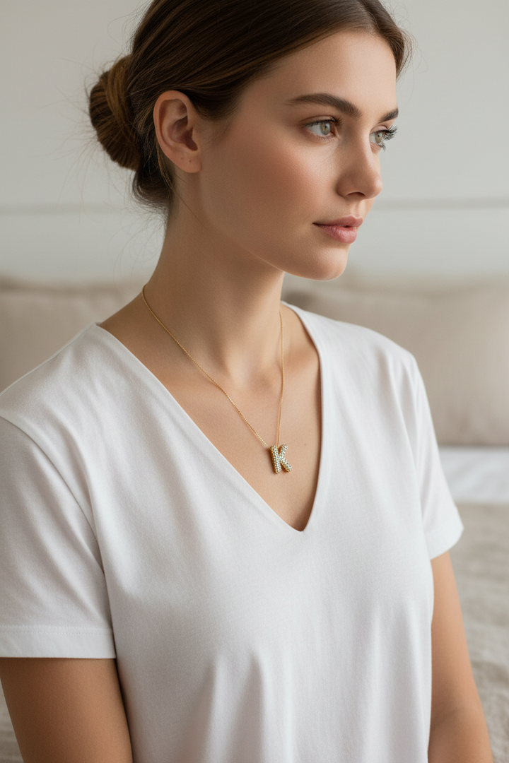Bubble initial rhinestone "K" pendant necklace, available in 16", 18", and 20" lengths.