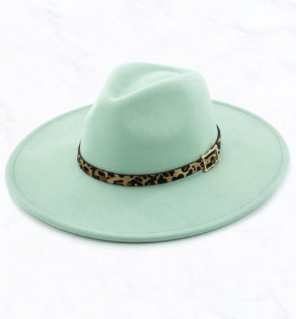 Light green fedora with wide, flat brim, leopard-print band, and small buckle. Available sizes: S, M, L.