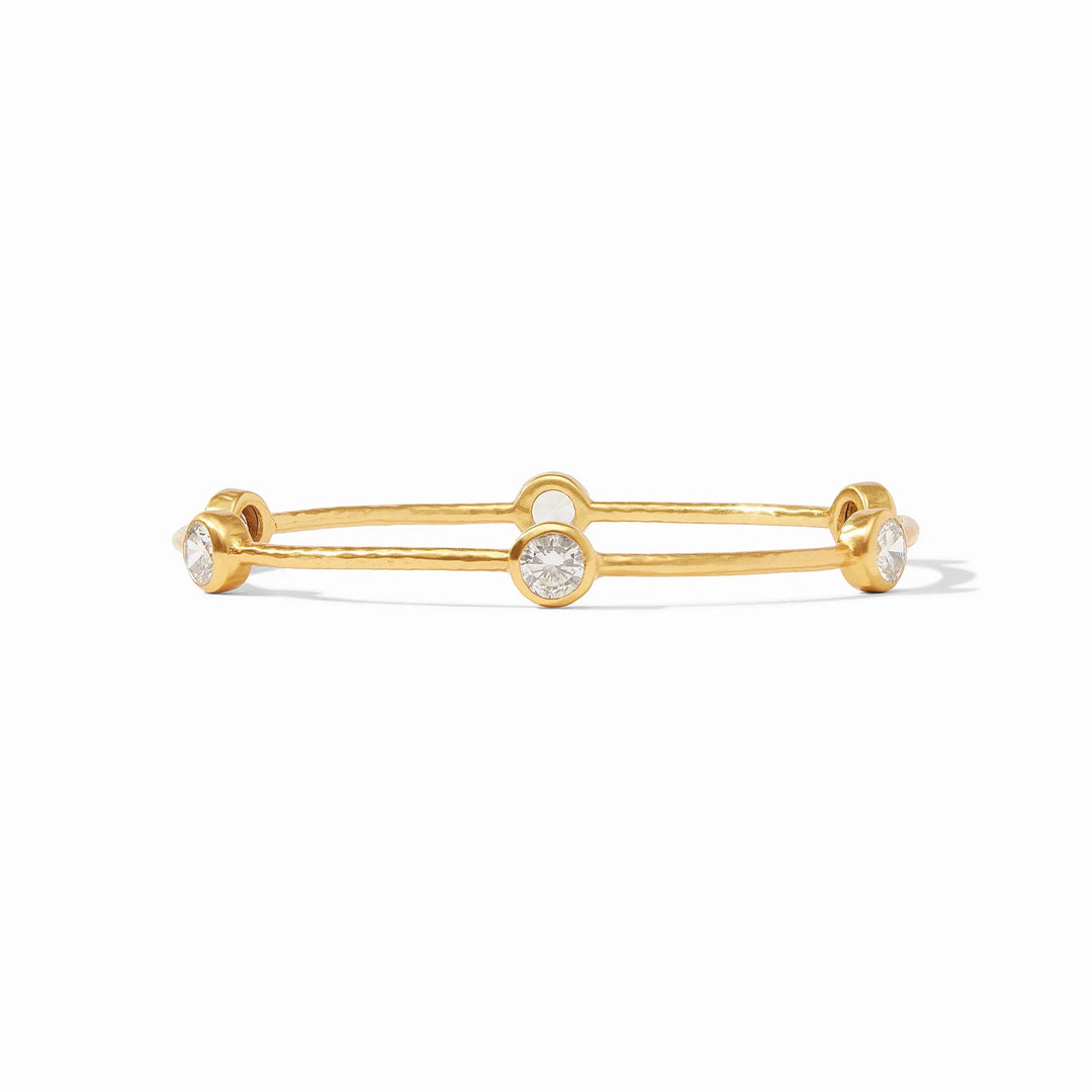 Milano Luxe Bangle, a hammered gold bracelet with three iridescent round clear stones. Available in various sizes.