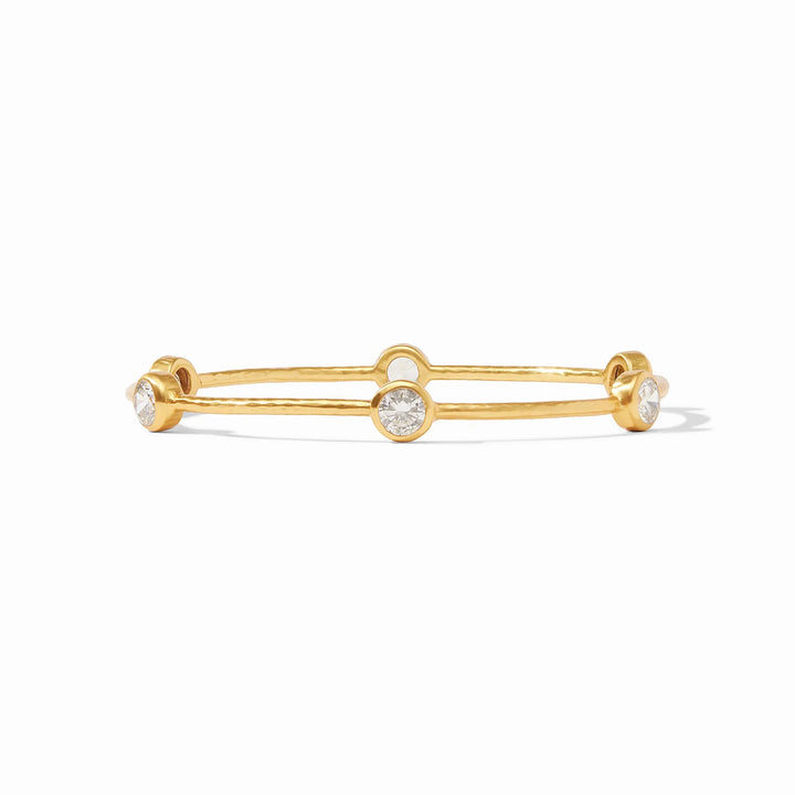 Milano Luxe Bangle, a hammered gold bracelet with three iridescent round clear stones. Available in various sizes.