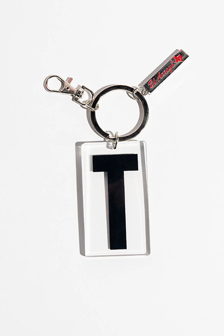 Rectangular acrylic keychain with bold black "T," clear case, metal ring, red text tag, bull silhouette. Sizes available.