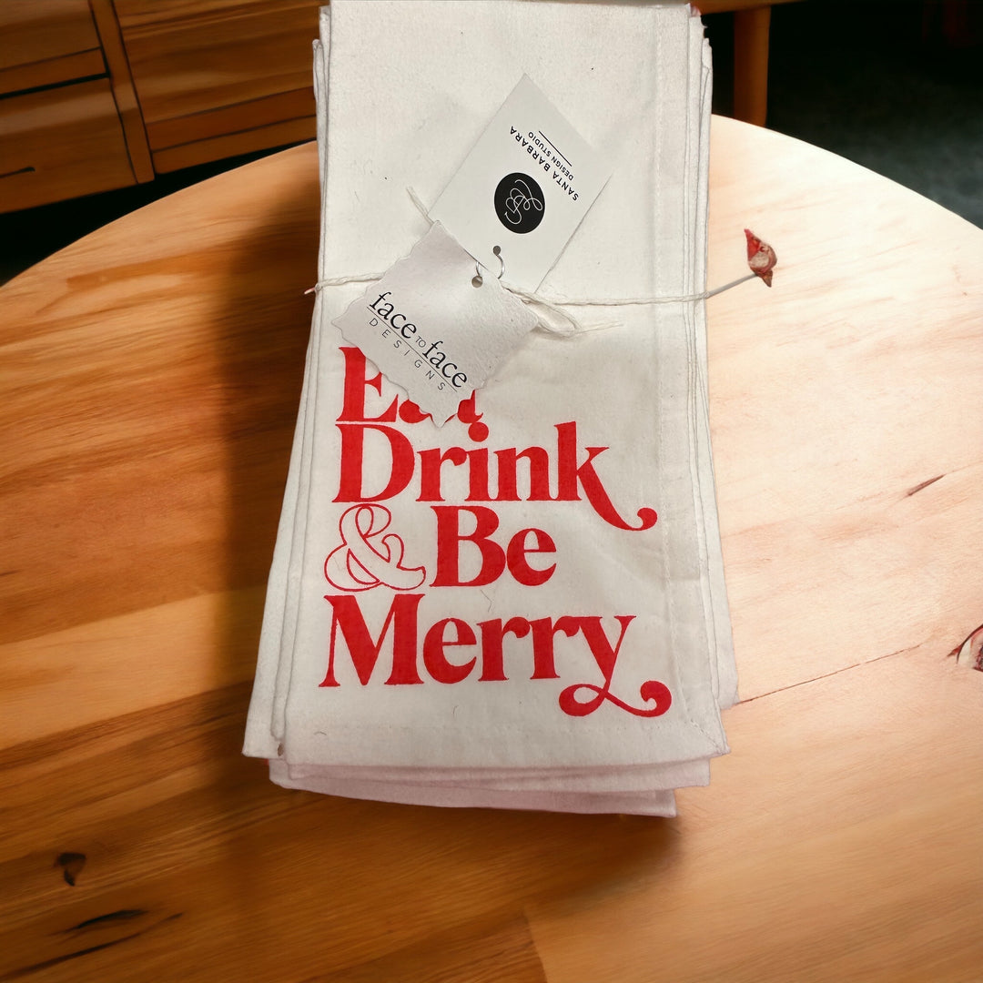 White Eat, Drink &amp; Be Merry dinner napkins with red text.
