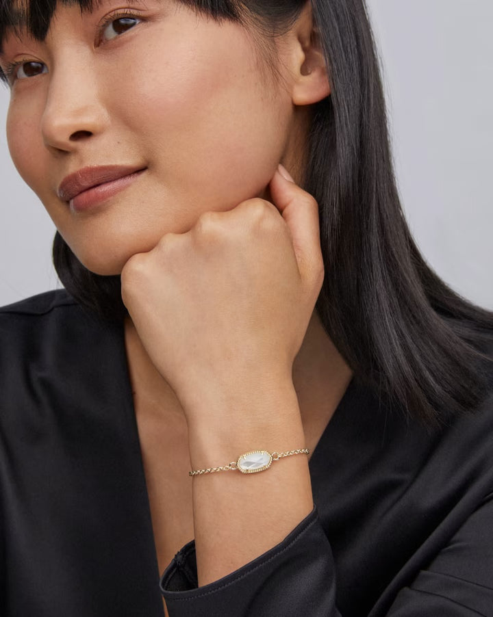 Elaina Adjustable Bracelet in Mother Of Pearl by Kendra Scott, available in 9", features a sliding closure and iridescent stone.