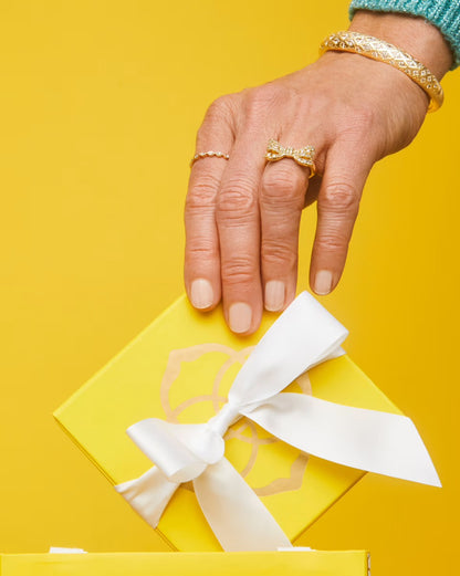Krista Bow Cocktail Ring by Kendra Scott; available in sizes 5-9. Gold-tone bow design.