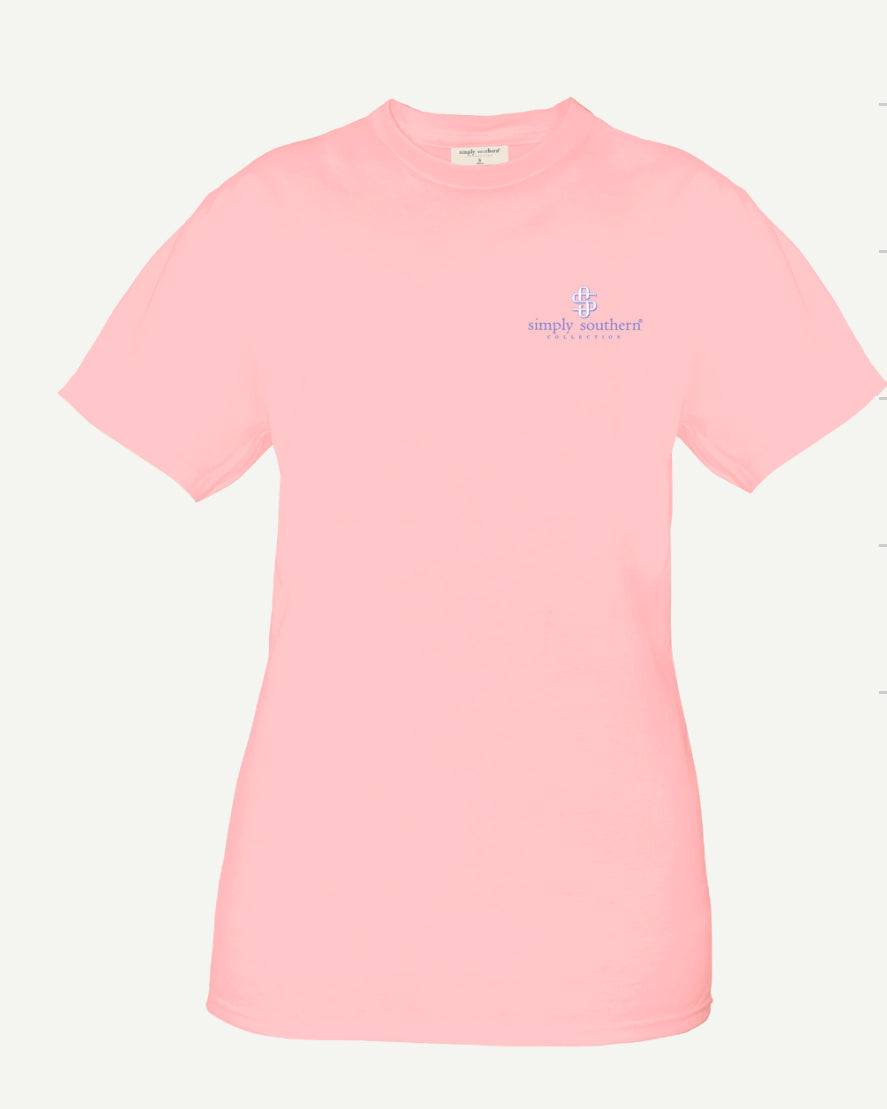 A light pink, 100% cotton short sleeve Crab Lotus Tshirt with the logo "Simply Southern" in small, blue text on the left chest area, displayed against a plain white background.