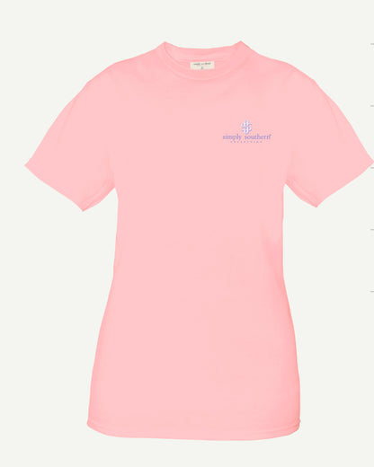 A light pink, 100% cotton short sleeve Crab Lotus Tshirt with the logo "Simply Southern" in small, blue text on the left chest area, displayed against a plain white background.