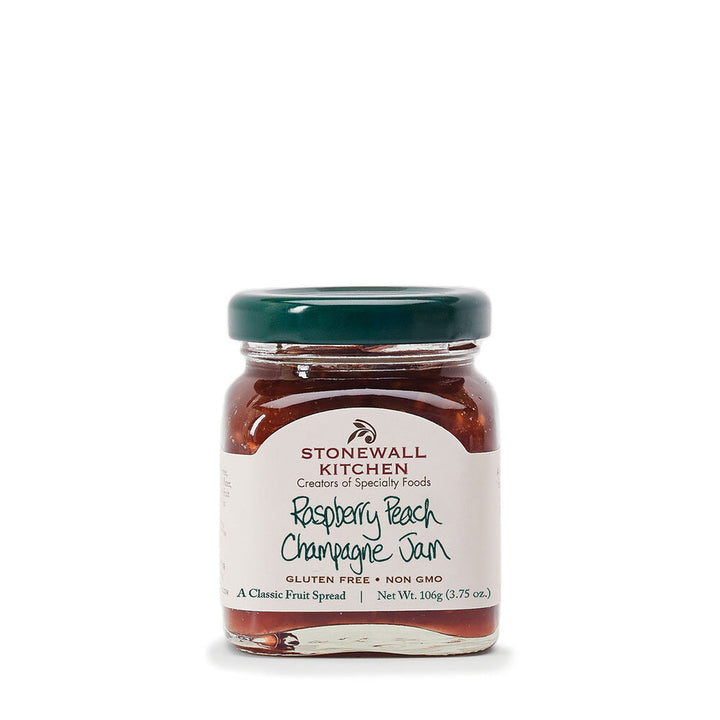 Stonewall Kitchen Mini Jam 3.75oz in glass jar with green lid, white label; gluten free, non-GMO Raspberry Peach Champagne flavor.