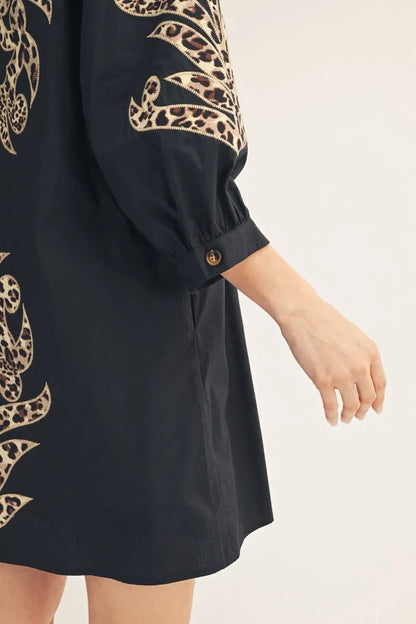 Black & Leopard Baroque Button Up Dress, mini length, features animal print accents on sleeves and sides. Available in sizes XS–XL.