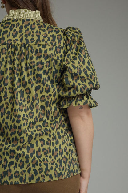 Olive Leopard Puff Sleeve Ruffle Top with dramatic puff sleeves, ruffle band collar, bold green and black leopard print. Available in sizes XS–XL.