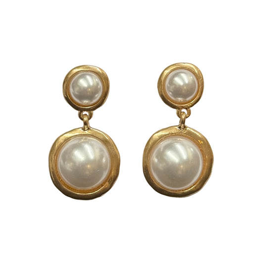 Tub Gold Pearl Dangle Post Earrings by Meghan Browne Style feature two round faux pearls—a smaller pearl on top and a larger one below—in textured gold-toned metal frames. Sizes available: one size.