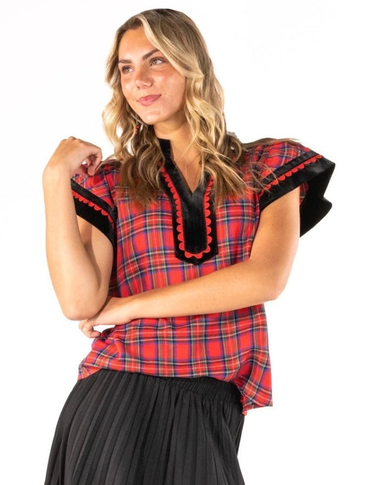 Red Plaid Scalloped Blouse with black and red ruffled velvet-trimmed sleeves. Available in sizes XS-XL.