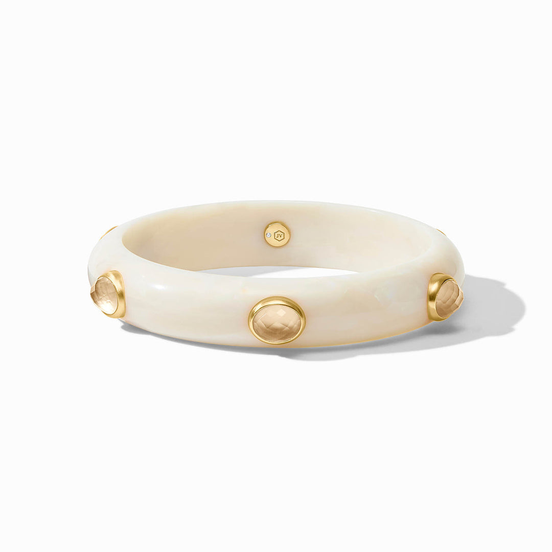 Thick ivory bangle with round gold studs and pale gemstones. Available sizes: S, M, L.
