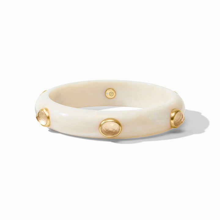 Thick ivory bangle with round gold studs and pale gemstones. Available sizes: S, M, L.