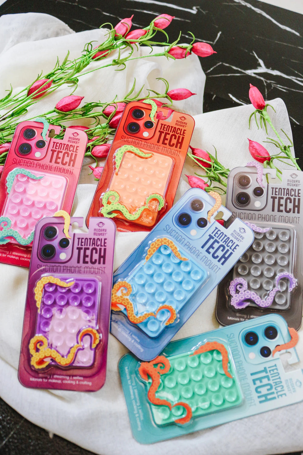 Tentacle Tech Suction Phone Mounts with bubble-popping fidget feature, available in small and large sizes.