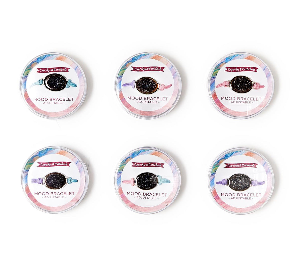 Set of six small round containers. Each labeled "Crystals for Kids" with an "Adjustable Mood Bracelet" inside. Bright, colorful packaging shows image and description of the mood-changing bracelet.