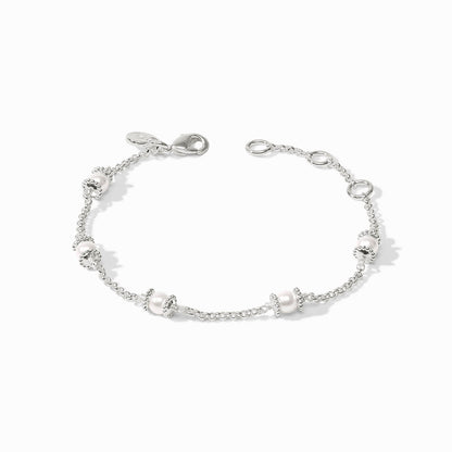 Silver chain bracelet with five small white beads framed by silver rings, lobster clasp. Available in multiple sizes.