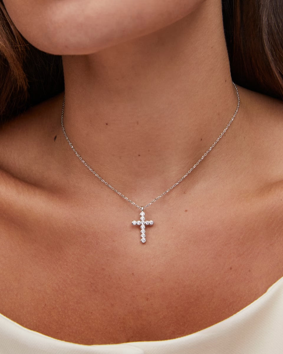 Kendra Scott Cross Pendant Necklace in White Crystal with adjustable chain. Available in small, medium, and large sizes.