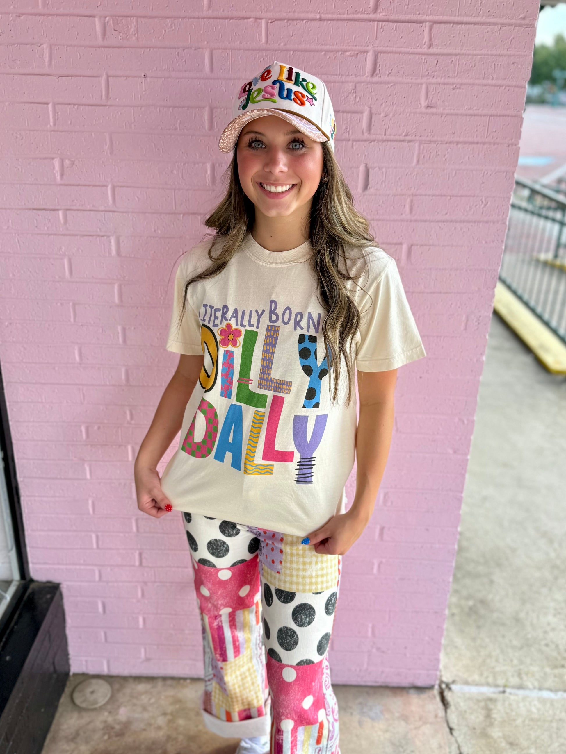 Literally Born to Dilly Dally" colorful graphic tee, available in sizes S–XXL.