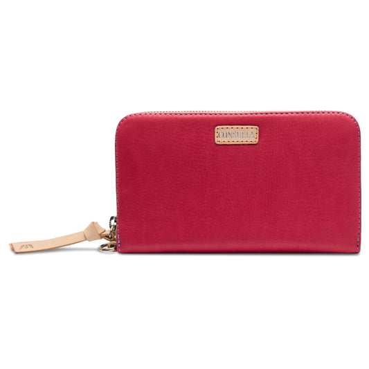 Red leather zip wallet with tan logo patch and wrist strap, debossed details; available in small and large sizes.