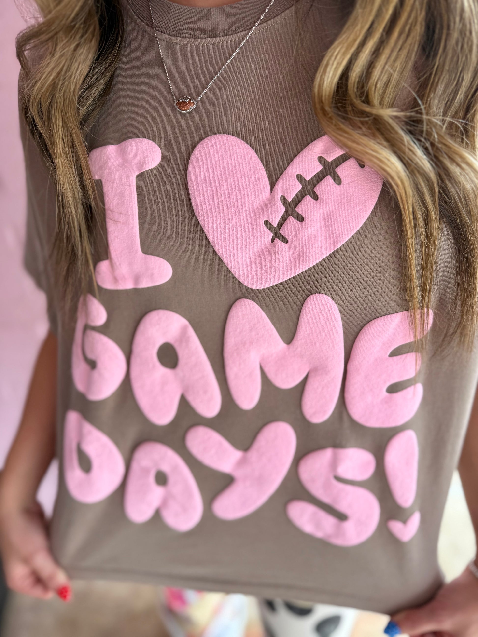 Cropped I Heart Game Day Tee with large pink "I ♥ GAME DAYS!" text and football heart. Available in sizes S-XL.
