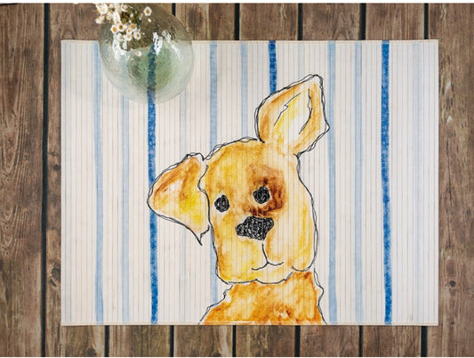 Bamboo mat with blue and white stripes on background and a hand drawn puppy with one ear up on the middle.