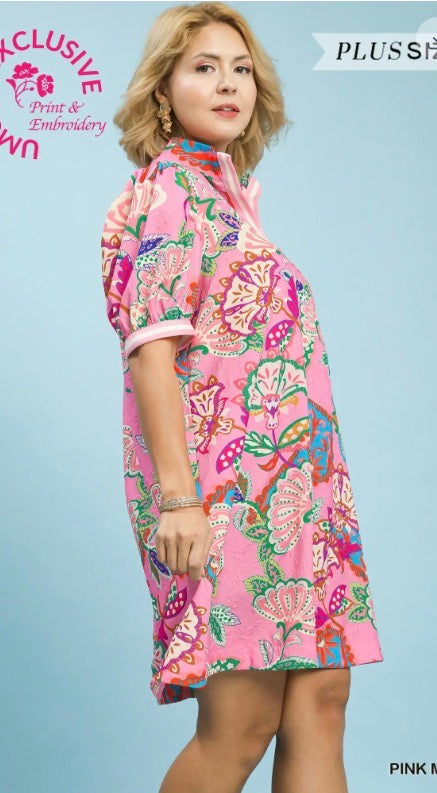 Jacquard Paisley Print Tunic Dress: short-sleeved mini dress with vibrant paisley patterns and white trim on sleeves and collar. Available in sizes XS–XL.