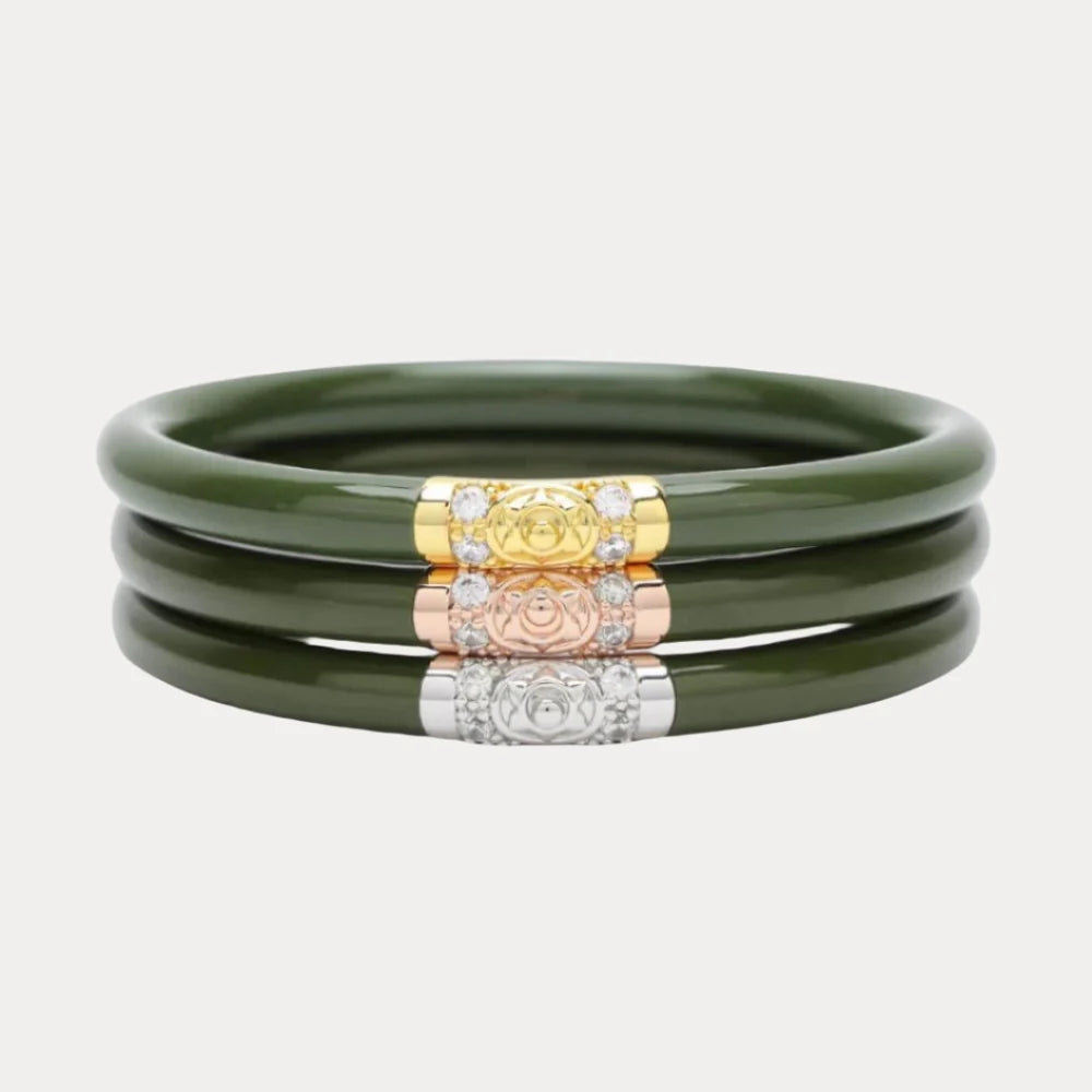 Set of three jade-hued bangle bracelets, each with a decorative clasp in gold, rose gold, or silver featuring an embossed emblem and clear stones. Available in small, medium, and large sizes.