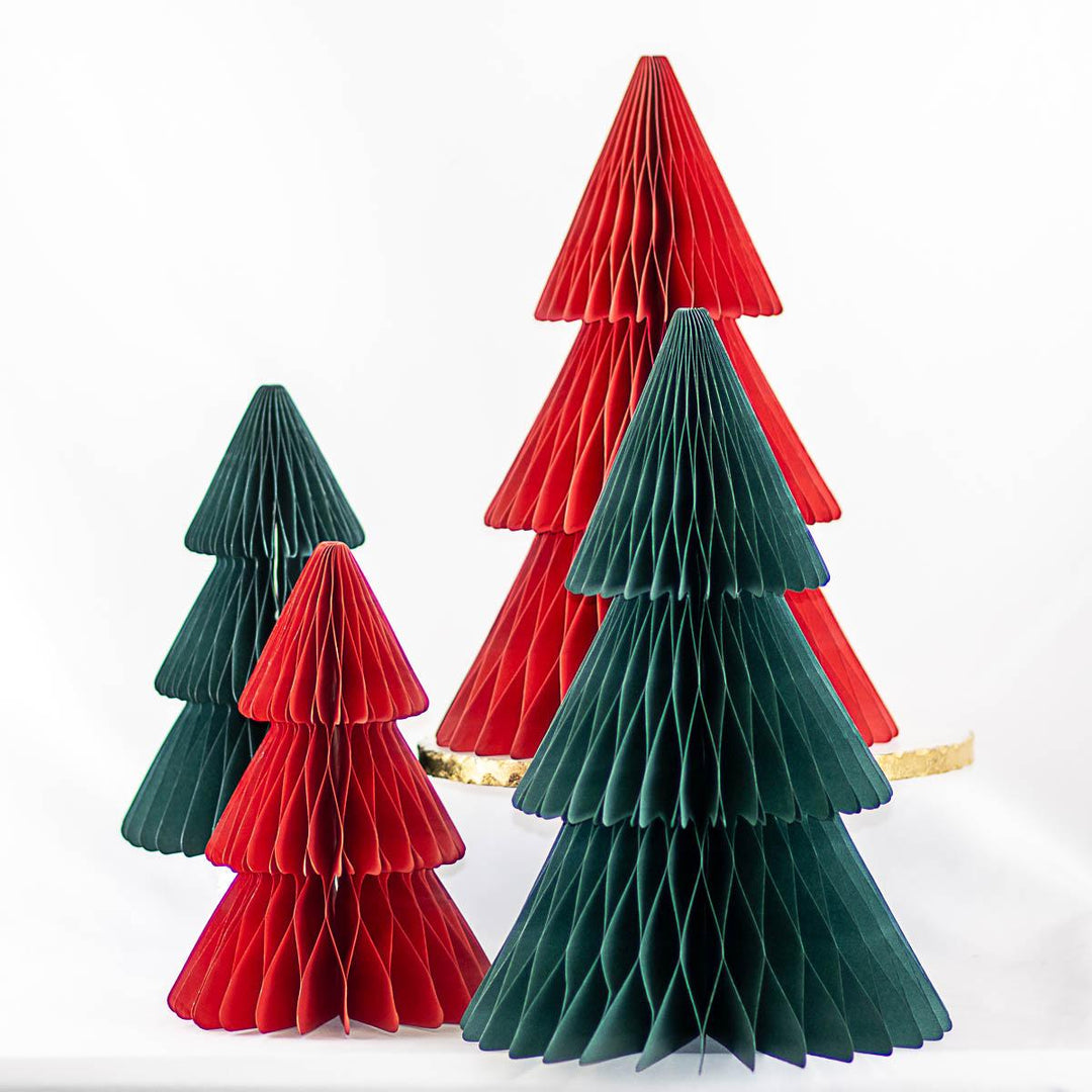 Four Accordion Paper Tree decorations in varying sizes, in shades of red and dark green.