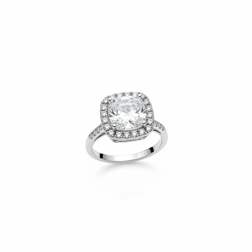 Midgle Silver Crystal Statement Ring with silver-tone finish, large square-cut clear gemstone center, smaller round diamonds on halo and band. Available in sizes 6, 7, and 8.