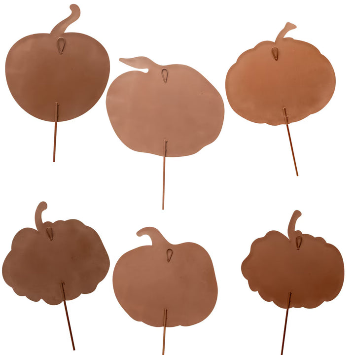 Six assorted brown and copper metal Beck’s Blue &amp; White Pumpkin silhouettes on stakes.