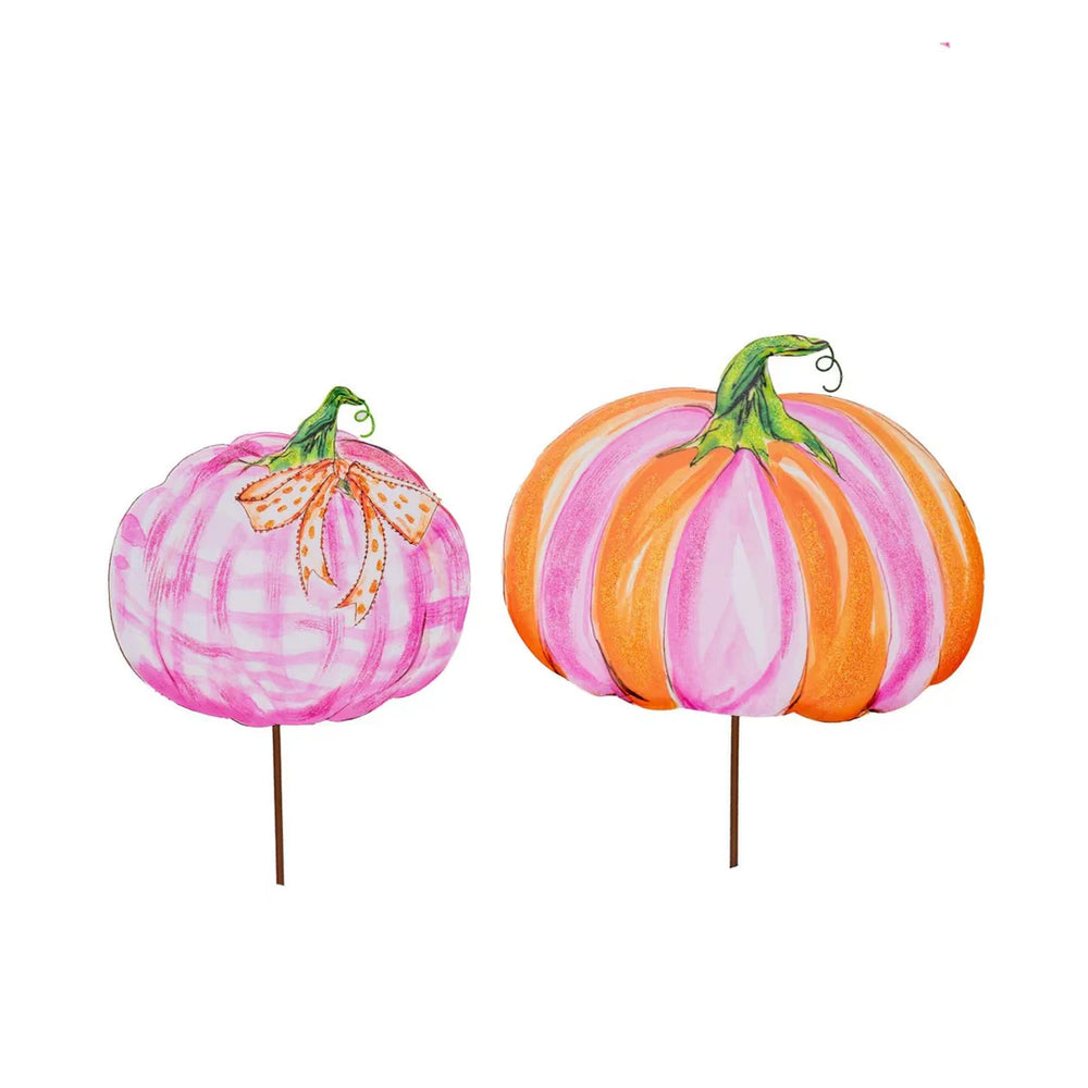 Beck’s Pink & Orange Pumpkin yard stakes: one pink plaid pumpkin with a ribbon and one with alternating pink and orange stripes.