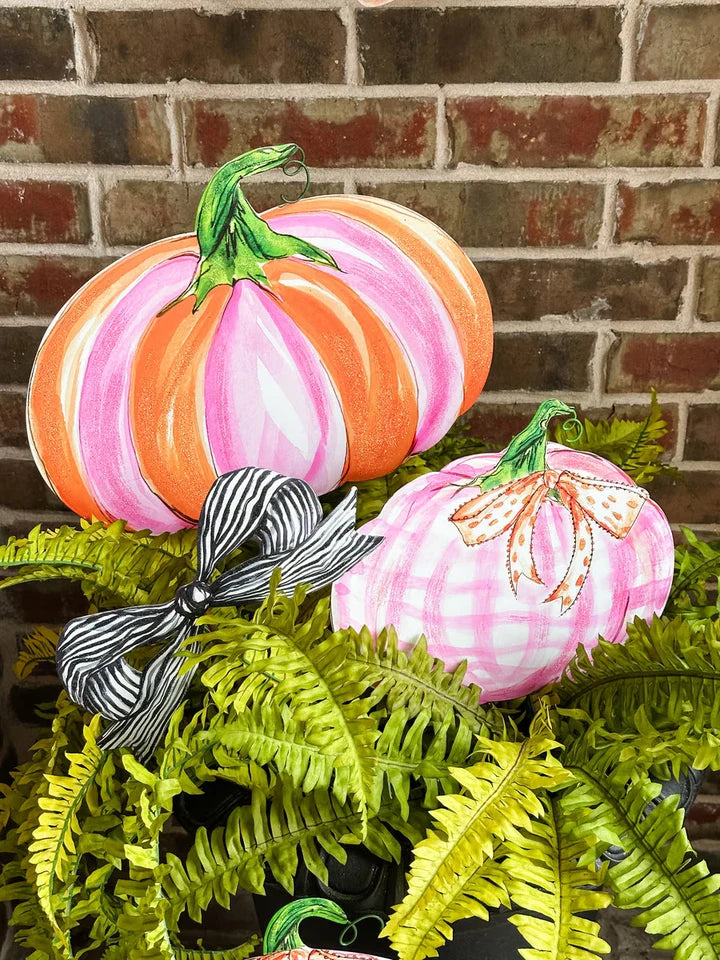 Beck’s Pink & Orange Pumpkins featuring one pink and orange striped pumpkin and one pink gingham pumpkin with ribbon and bow accents.