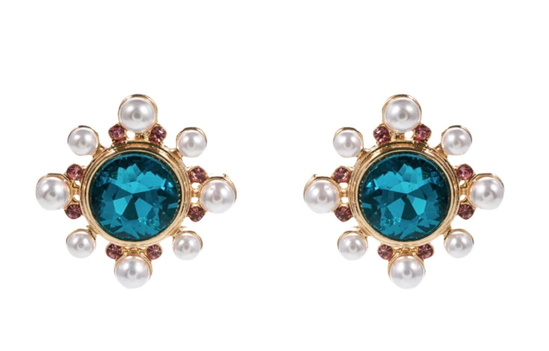 Circle Burst Stud Earrings: gold studs with central bold blue gemstones, surrounded by delicate pearls and pink stones. Available in small, medium, and large sizes.