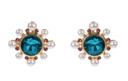Circle Burst Stud Earrings: gold studs with central bold blue gemstones, surrounded by delicate pearls and pink stones. Available in small, medium, and large sizes.